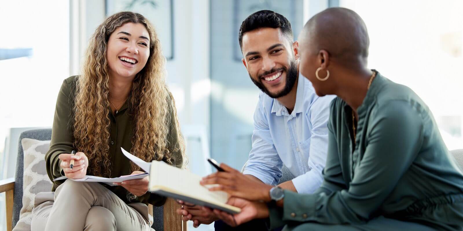 business people smile during a planning meeting in a startup marketing agency office