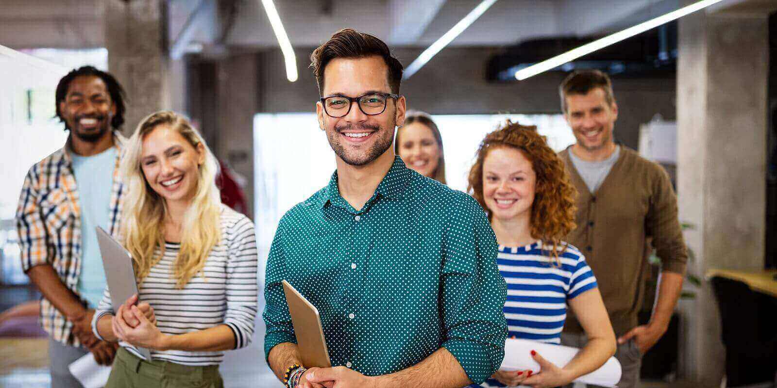 company with happy employees in modern office