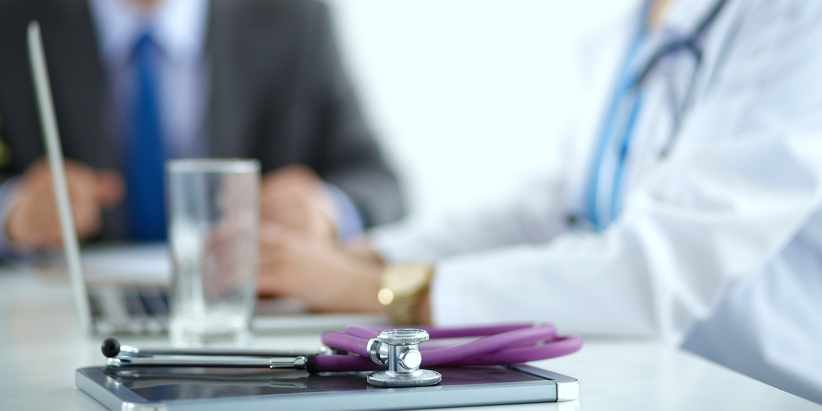 Healthcare professionals sitting at desk
