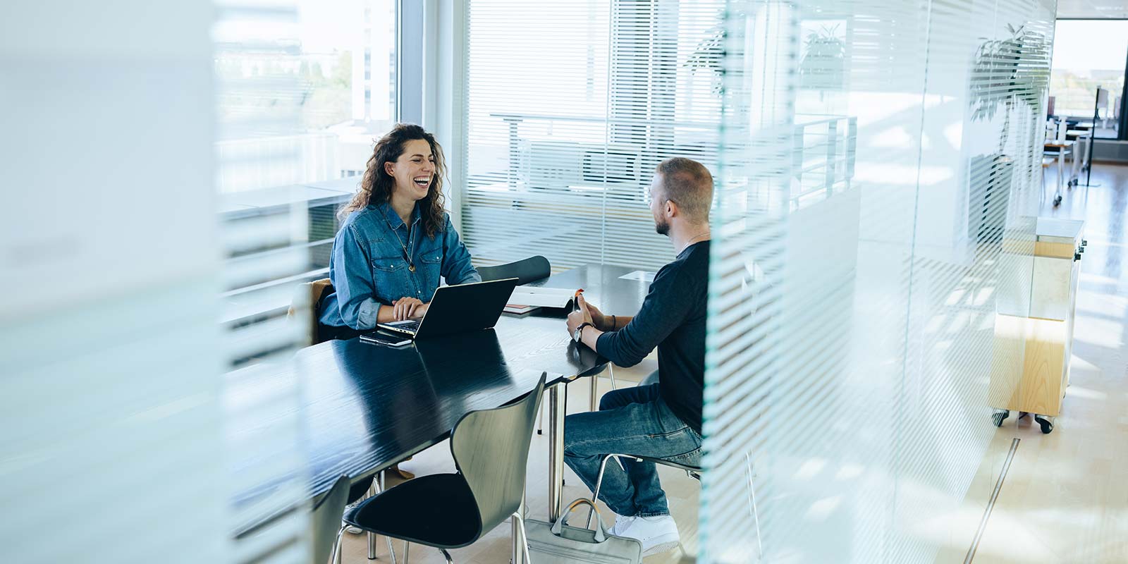 Employees talking in the office to each other