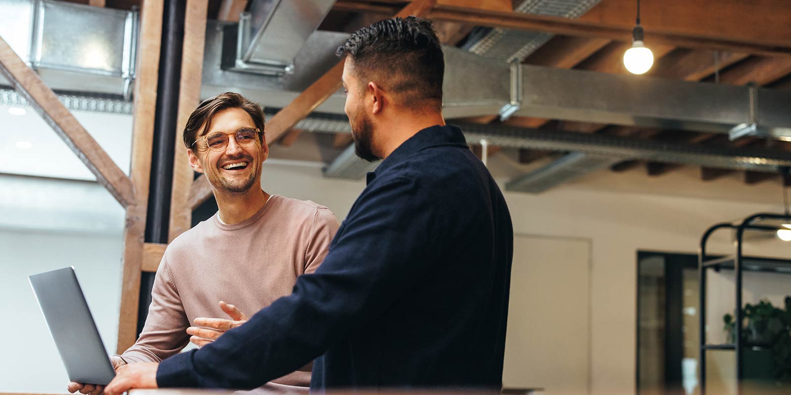 Two employees talking to each other.