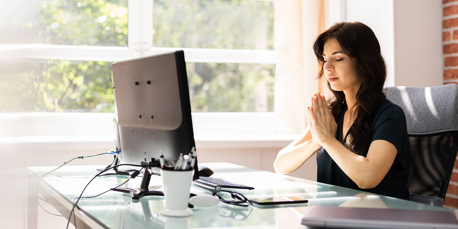 Employee praying at their desk
