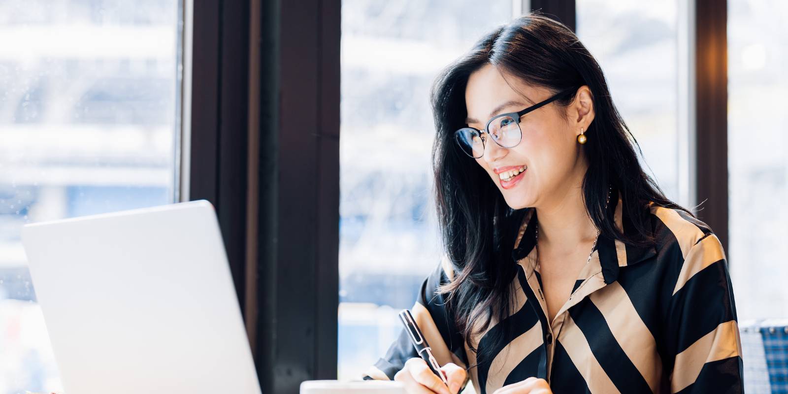 employer working at laptop