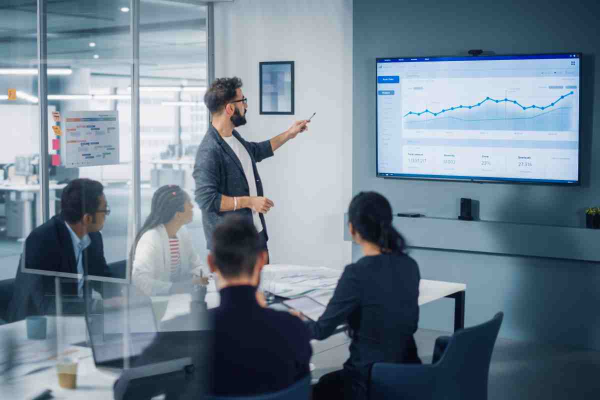 Diverse Modern Office: Motivated Businessman Leads Business Meet