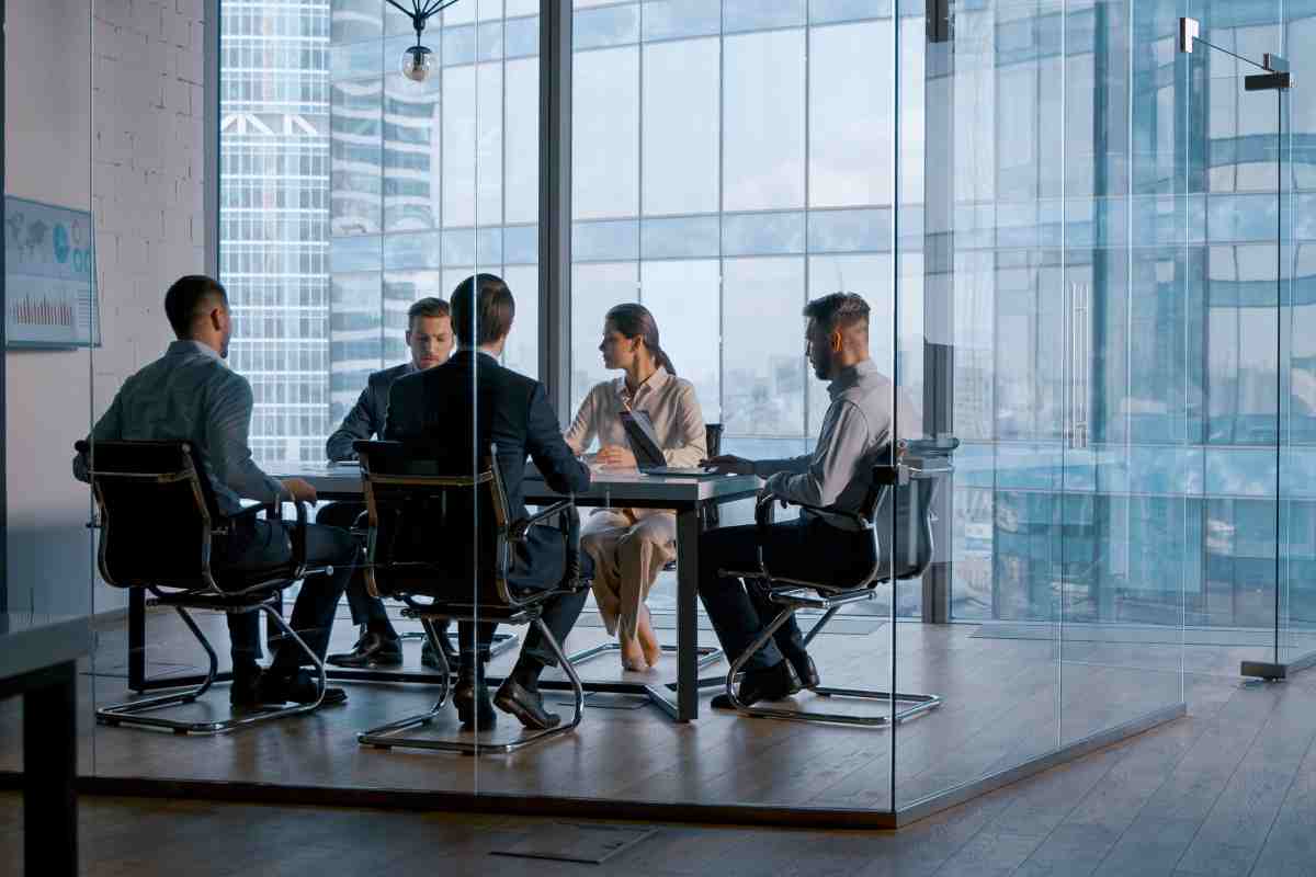 Young business people attending the meeting in boardroom in business district