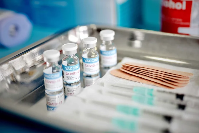 Vials-With-the-Covid-19-Vaccine-and-Syringes-are-Displayed-On-a-Tray-at-the-Corona-Vaccination-Center