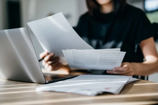 Person-Computer-Paperwork-600-400