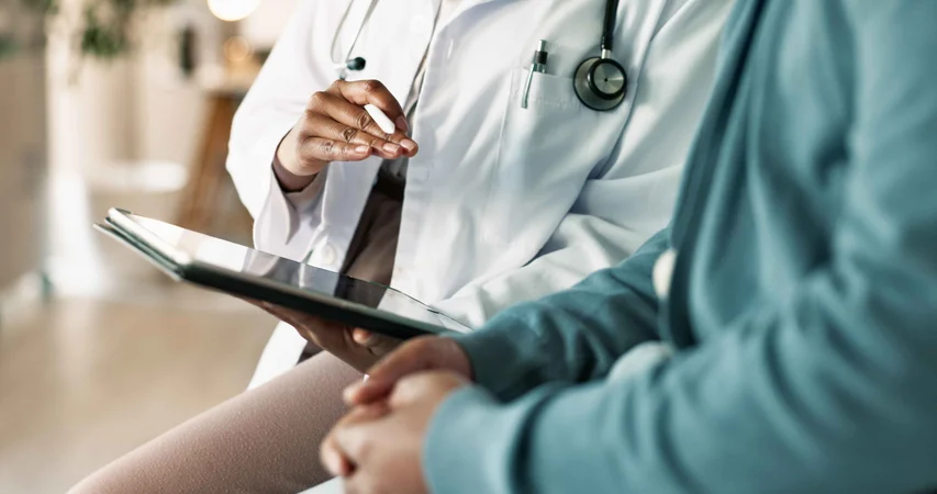 Tablet,-hands-and-patient-with-doctor-in-hospital-for-consultation-with-cold,-flu-and-sickness.